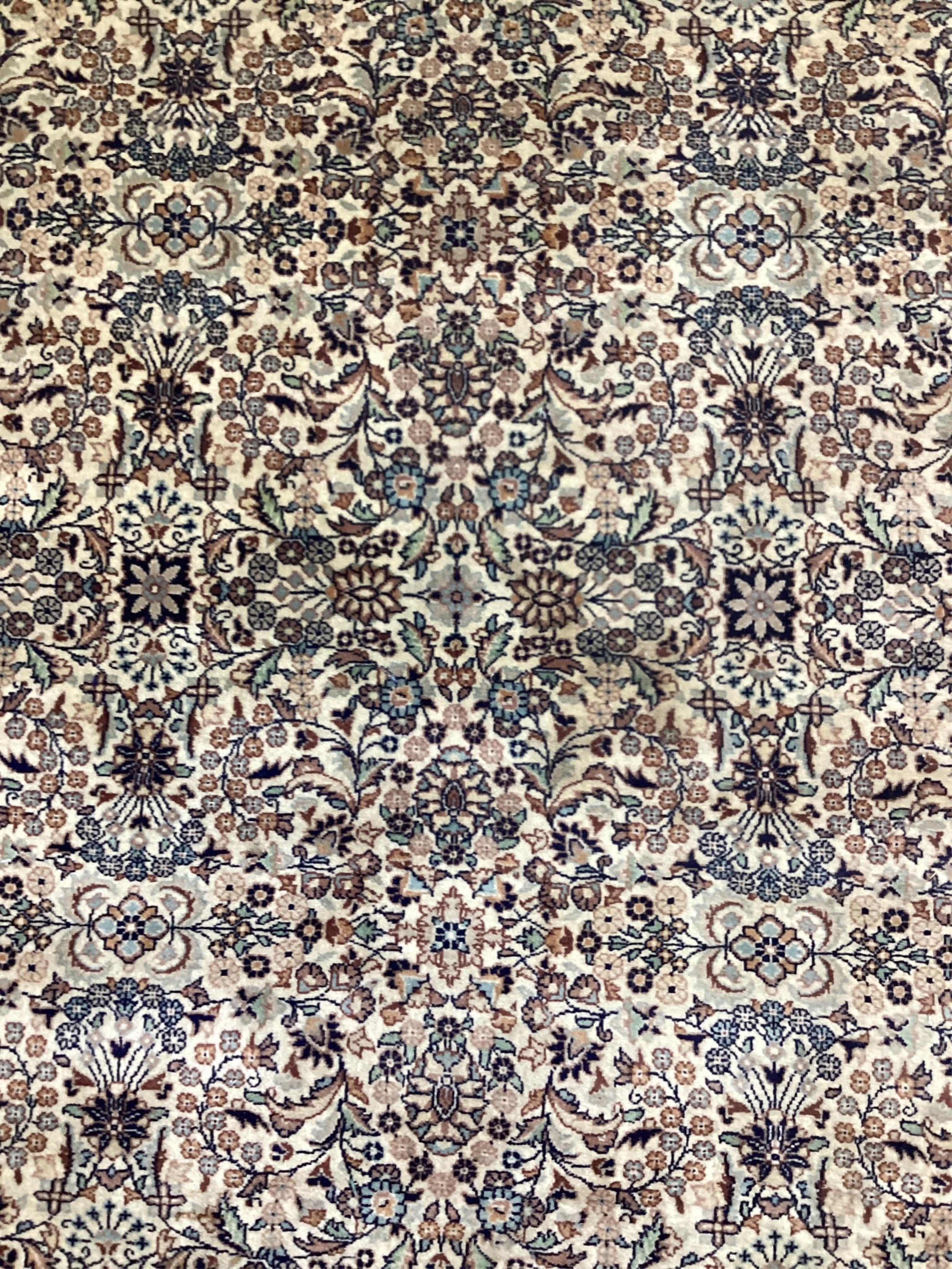 An Hereke ivory ground rug, 204 x 136cm. Condition - good